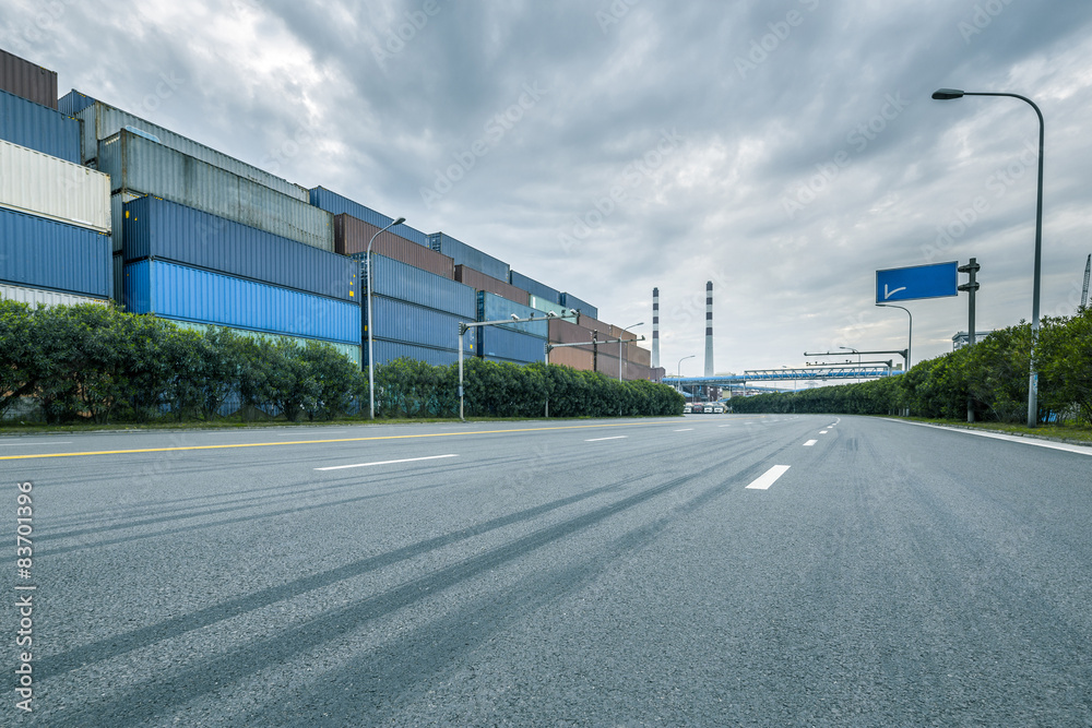 Empty road near container dock Empty road near container dock