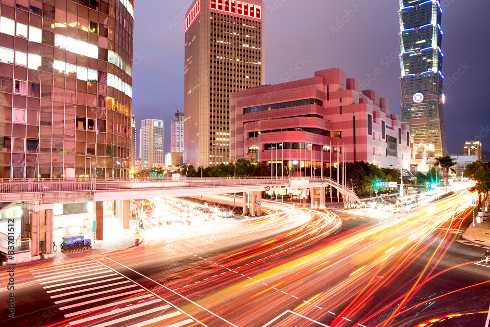 Fototapeta premium traffic blurred motion and office buildings