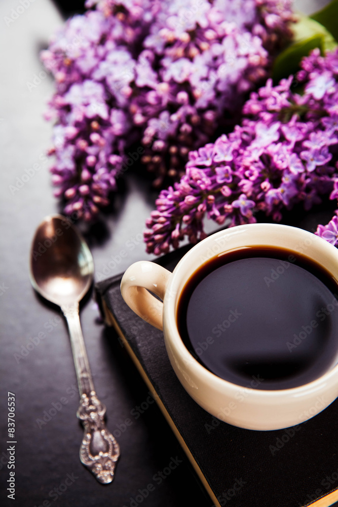 Black coffee in a cup, book