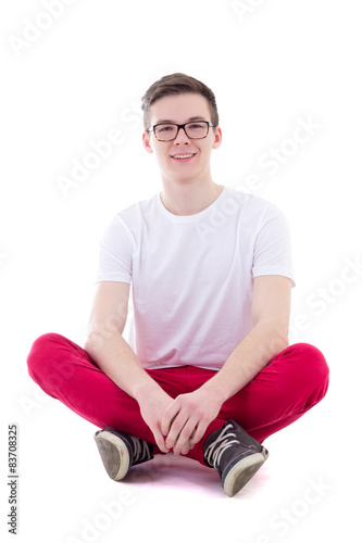 young handsome man in white t-shirt sitting isolated on white