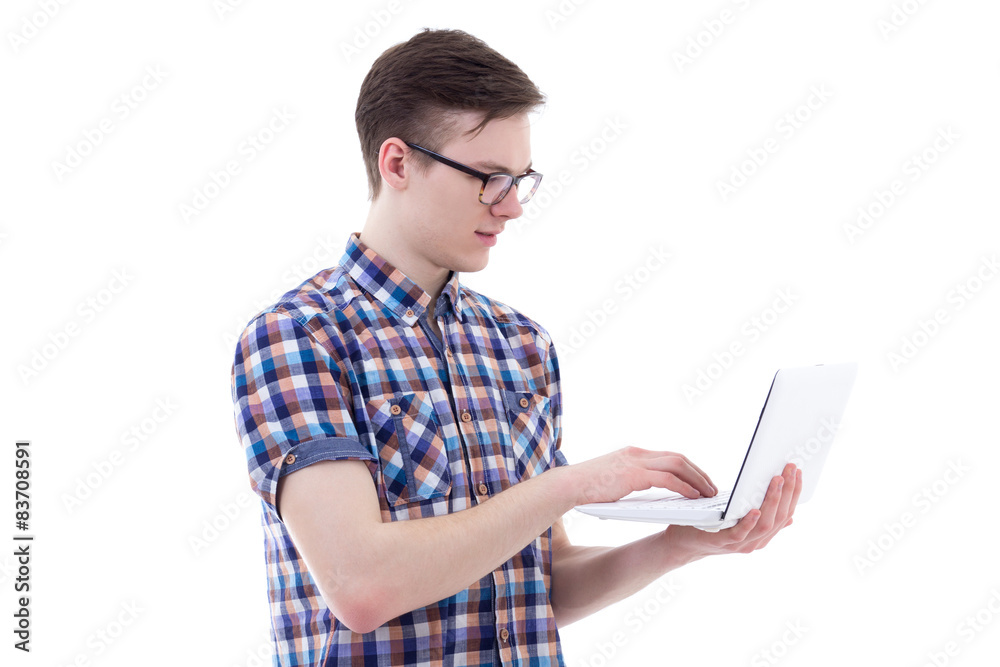 handsome teenage boy using laptop isolated on white handsome teenage boy using laptop isolated on white