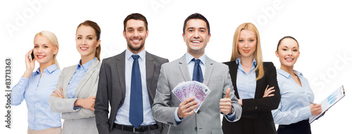 smiling businessman with american dollar money