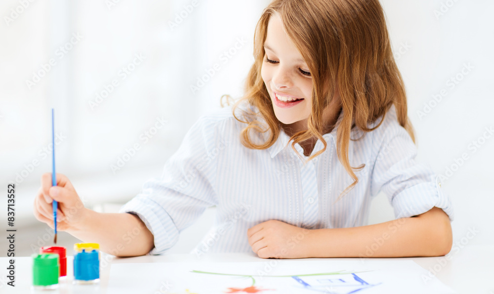 little girl painting at school little girl painting at school