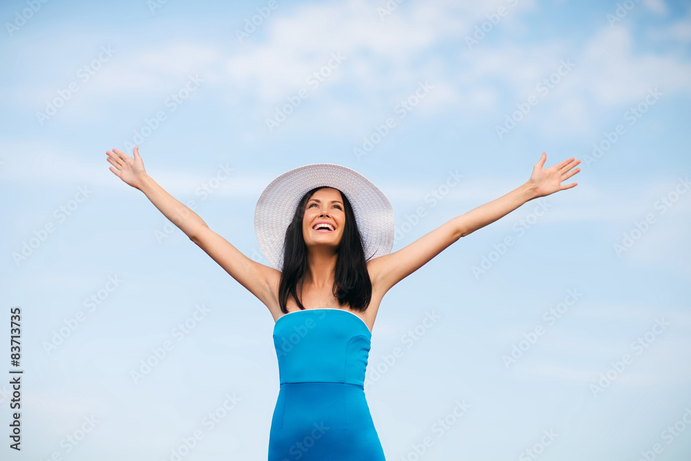 girl with hands up on the beach girl with hands up on the beach