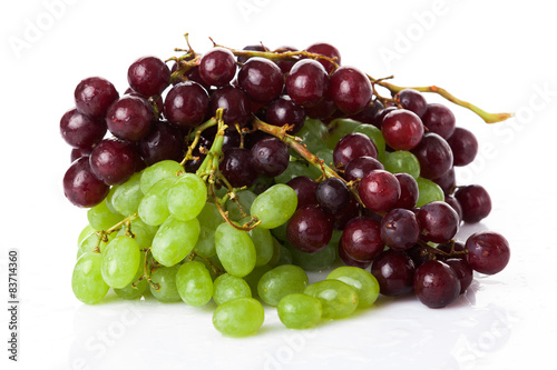 Black and white grapes isolated on white background