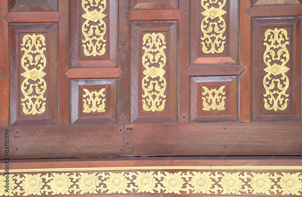 pattern in traditional Thai style art on wall of the temple