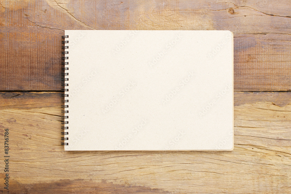 Notebook on wooden table Notebook on wooden table