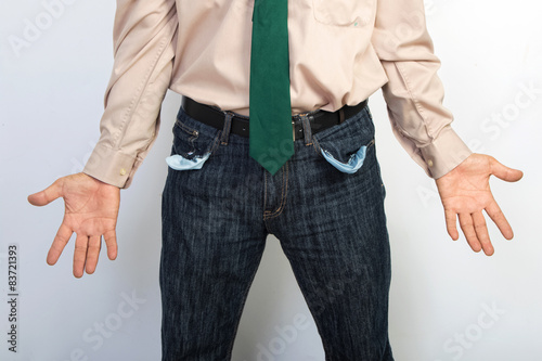 Businessman showing empty pockets concept for bankruptcy, povert
