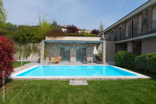 residence with nature stone walls and turquois swimming pool © A2LE