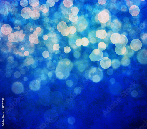 Glowing bokeh effects on a textured paper background