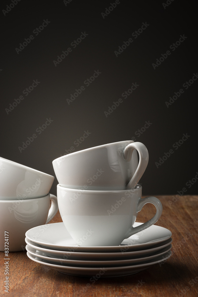Two plain white pottery tea or coffee cups