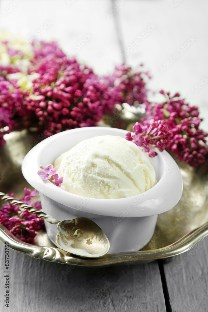 Beautiful composition with tasty ice cream and lilac flowers Beautiful composition with tasty ice cream and lilac flowers