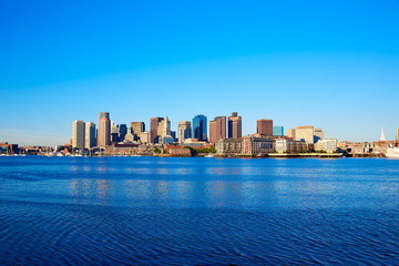 Boston skyline with river sunlight Massachusetts