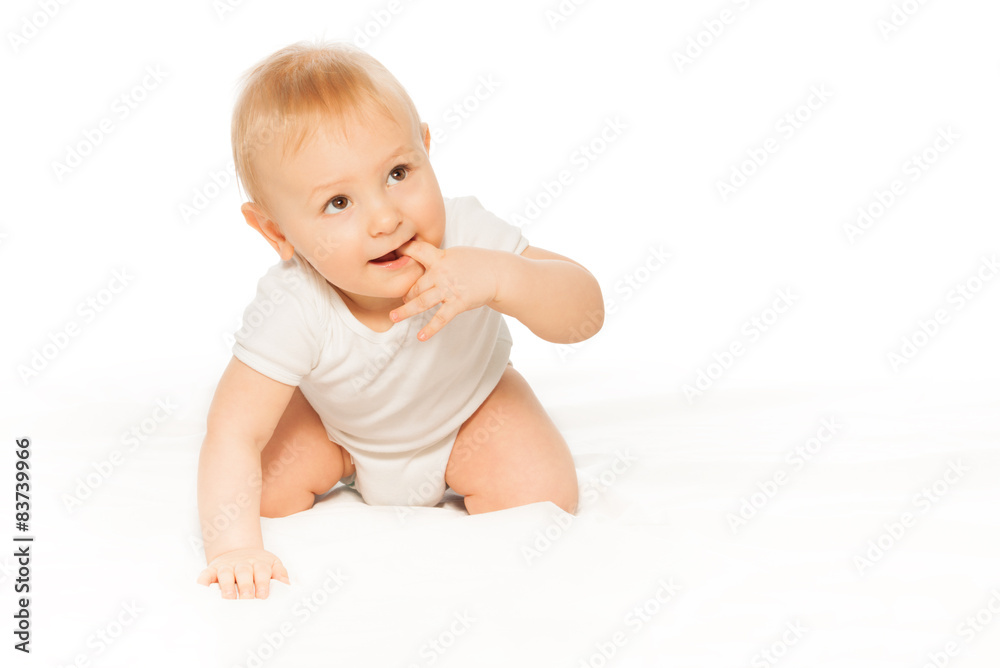 Baby with finger in his mouth wearing white body Baby with finger in his mouth wearing white body