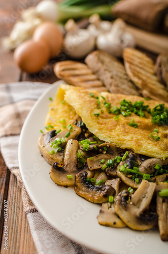 Rustic omelette with mushrooms on chives