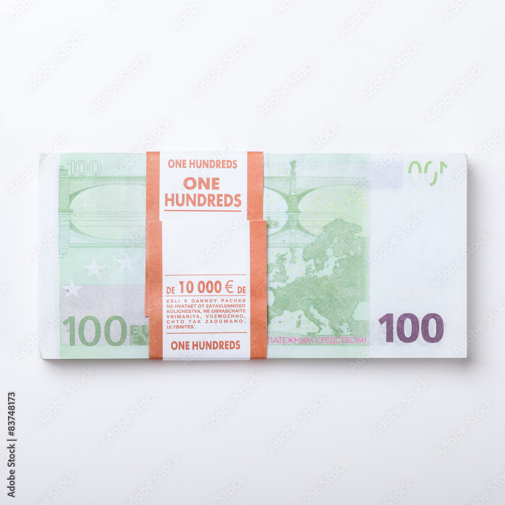 Close-up of 100 Euro banknotes isolated on white background. Close-up of 100 Euro banknotes isolated on white background.