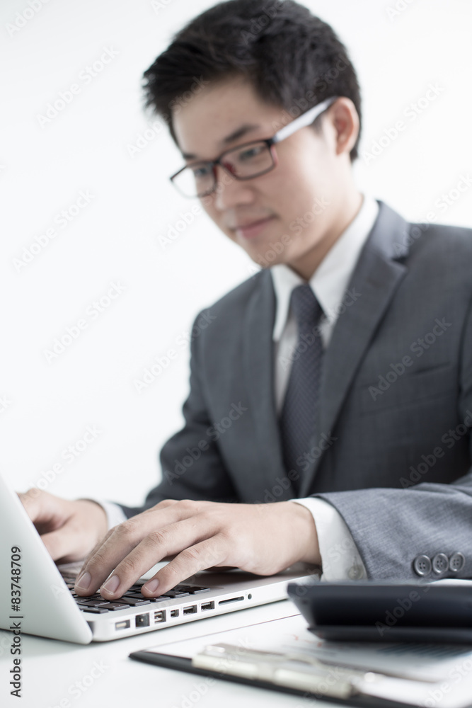 Handsome businessman working with laptop Handsome businessman working with laptop