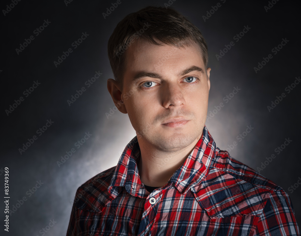 Sad young man, portrait on the dark background. Sad young man, portrait on the dark background.