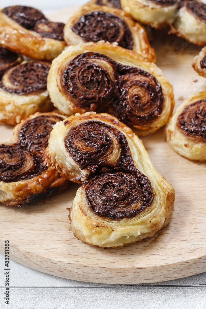 Palmier biscuits - french cookies made of puff pastry and chocol Palmier biscuits - french cookies made of puff pastry and chocol