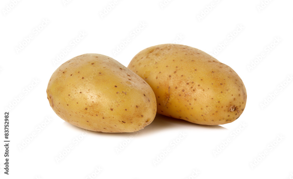 closeup unpeeled fresh potato on white background closeup unpeeled fresh potato on white background
