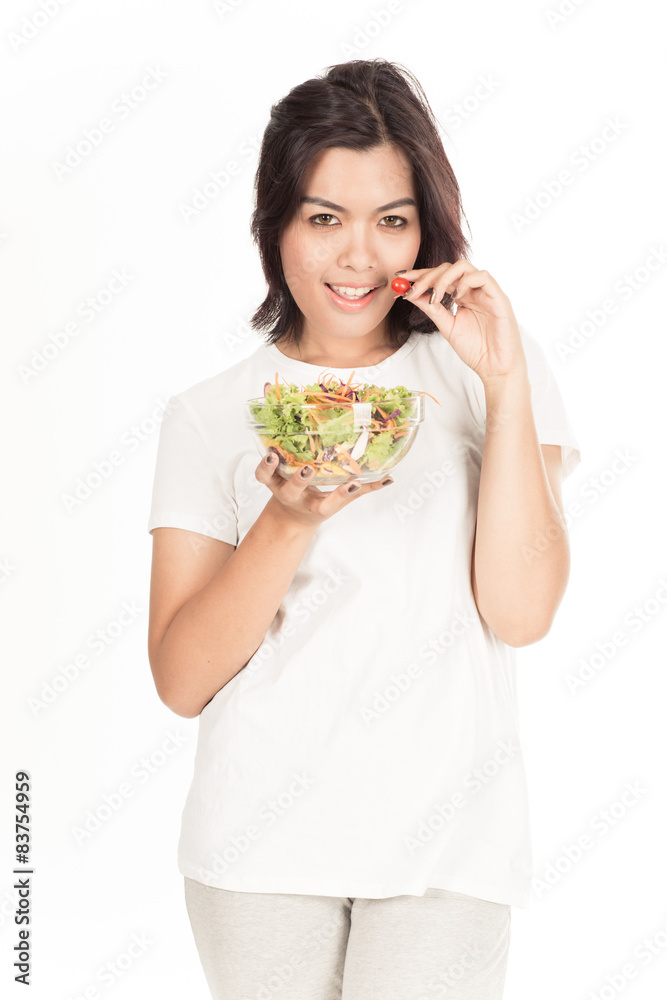 Pretty girl eating fresh vegetable salad Pretty girl eating fresh vegetable salad