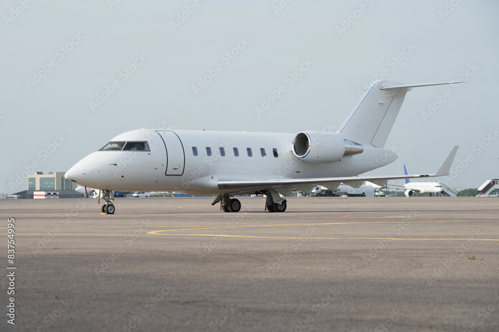 Business jet airplane on the ground.