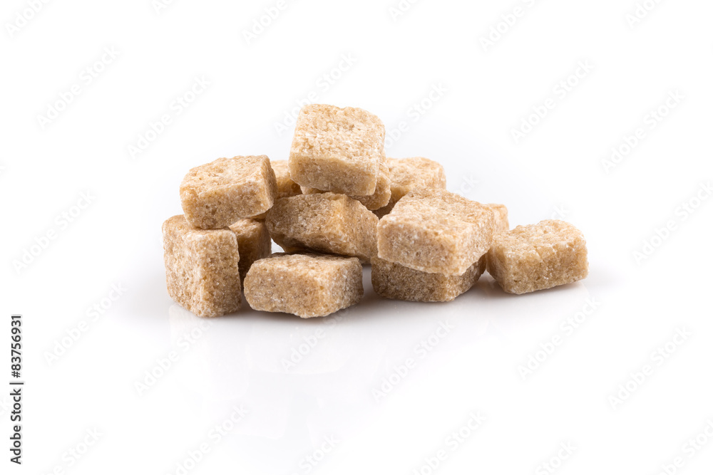 Heap brown sugar cubes isolated Heap brown sugar cubes isolated