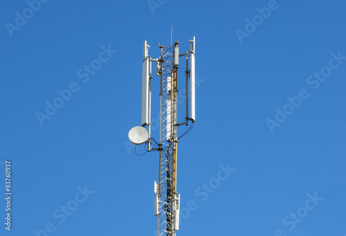 Cellular transmitter on blue sky background