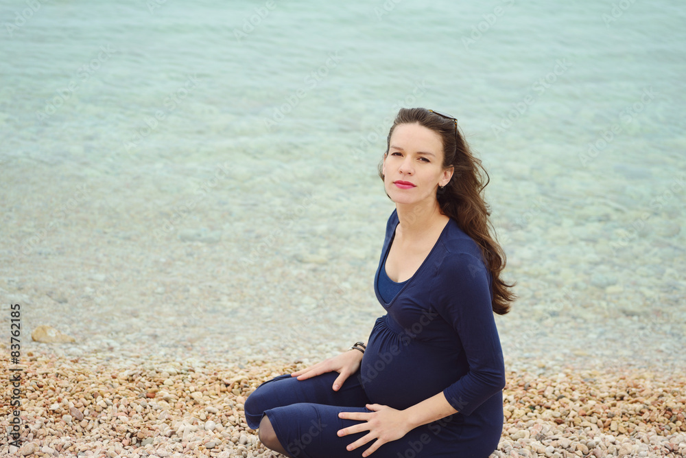 pregnant woman next to the sea