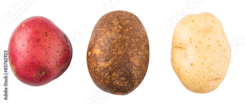 Photography Red, brown, yellow potatoes on white background