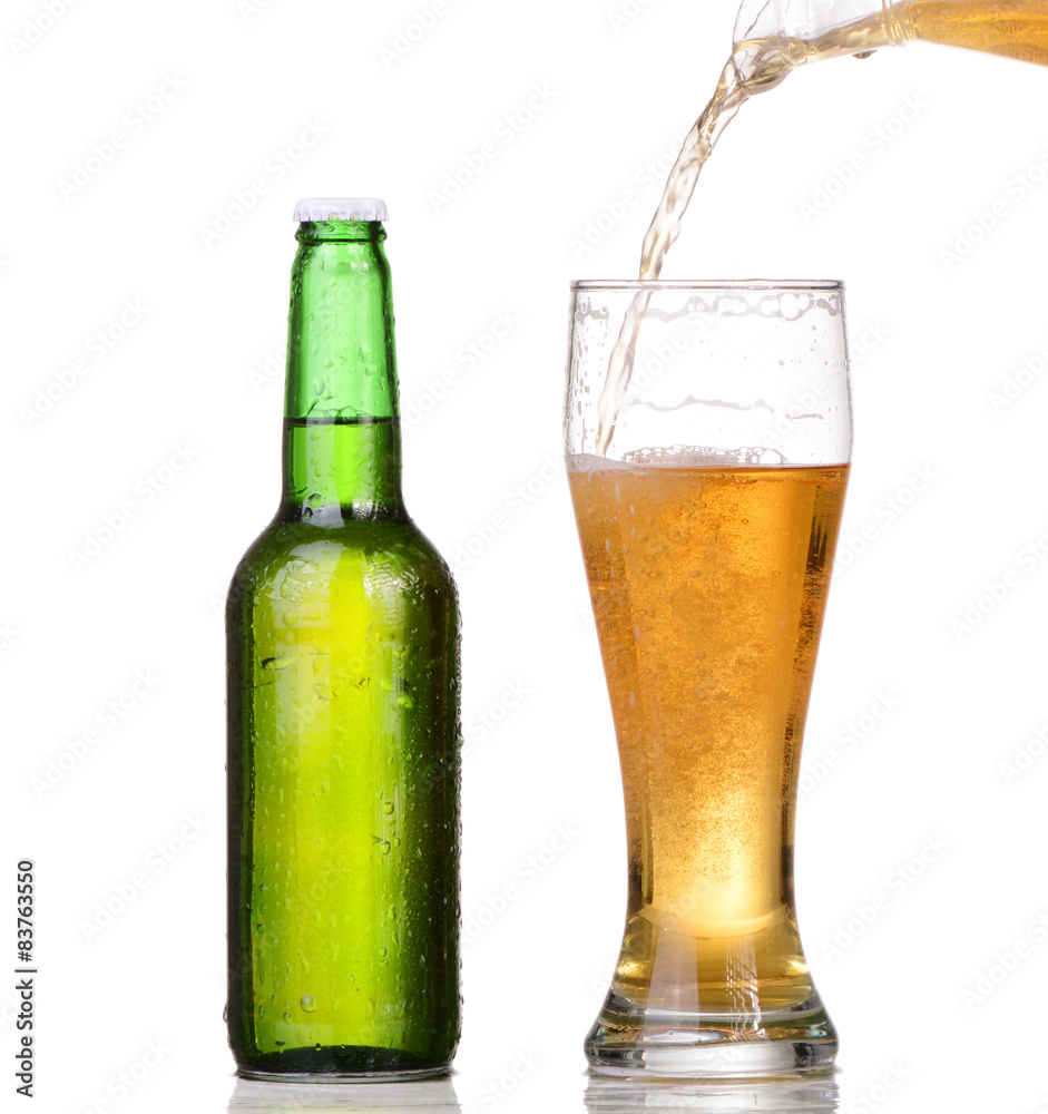 Chilled green bottle with condensate and a glass of beer Chilled green bottle with condensate and a glass of beer