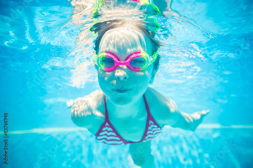Underwater portrait of happy child