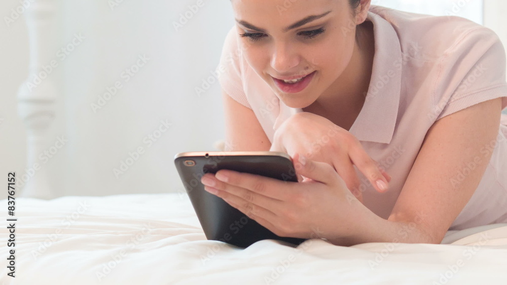 Woman looking for something in tablet Woman looking for something in tablet