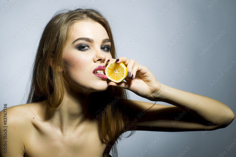 Ardent blonde girl portrait with orange Ardent blonde girl portrait with orange