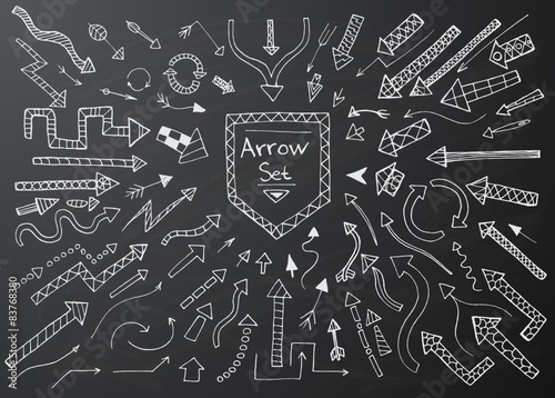 Hand drawn arrow icons set on black chalk board