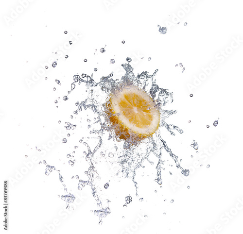 segment of lemon falling in to the water and making splash