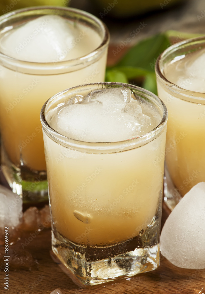 Pear fresh juice with ice in a heart-shaped and pear on a wooden Pear fresh juice with ice in a heart-shaped and pear on a wooden