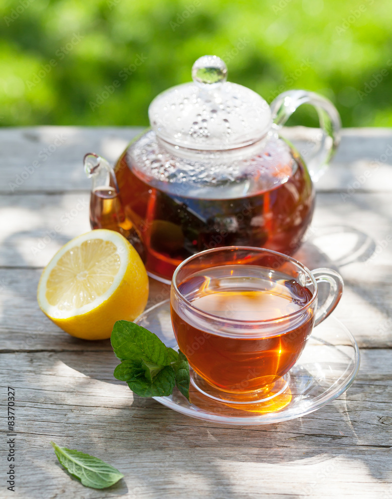 Breakfast tea on table in garden Breakfast tea on table in garden