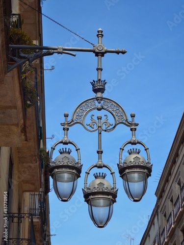 Barcelona public light lamp in a blue sky day 