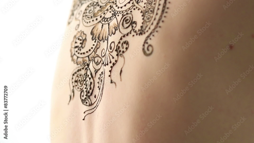 Mehendi. Creating complex pattern on model's back Mehendi. Creating complex pattern on model's back