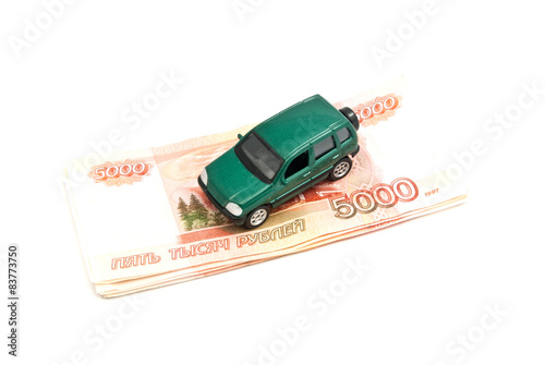 green car and Russian banknotes
