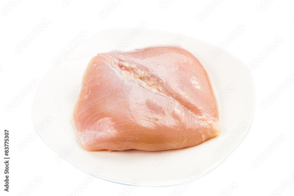 Fresh heart shaped skinless chicken breast meat on a plate Fresh heart shaped skinless chicken breast meat on a plate