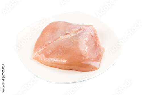 Fresh heart shaped skinless chicken breast meat on a plate