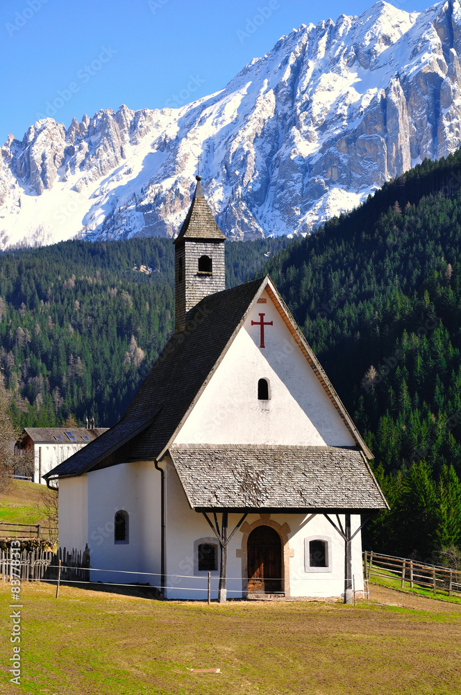Small rural church in mountain landscape. Italy.
