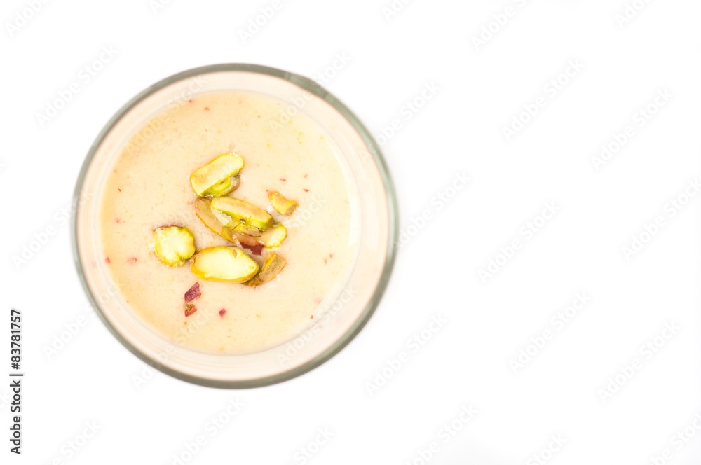 Fruit smoothie topped with pistachio nuts