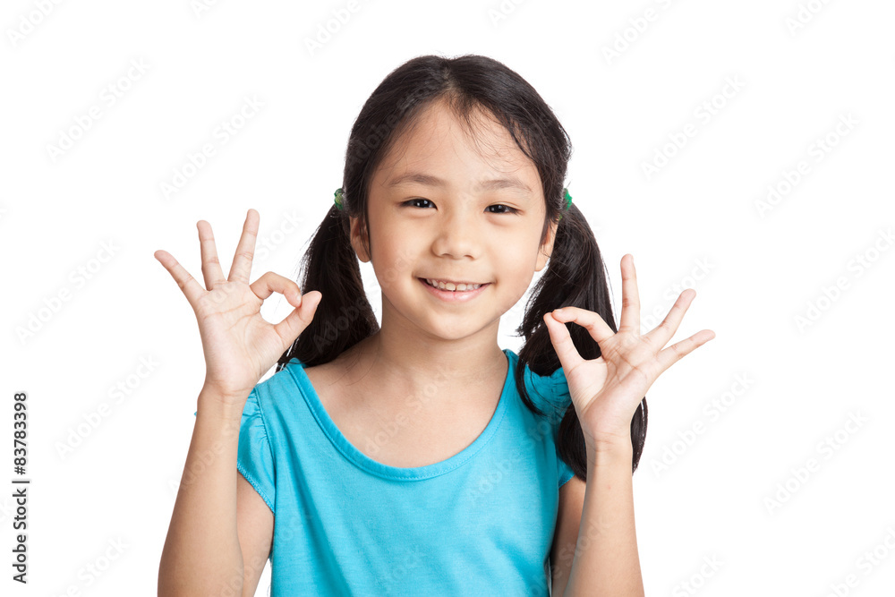 Little asian girl smile show OK sign