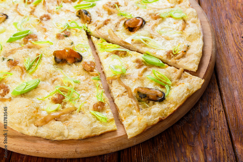 Delicious seafood pizza with olives Delicious seafood pizza with olives