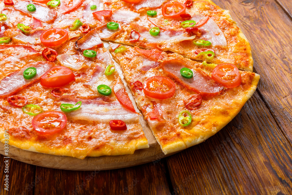 Delicious pizza with red and green hot chili peppers Delicious pizza with red and green hot chili peppers
