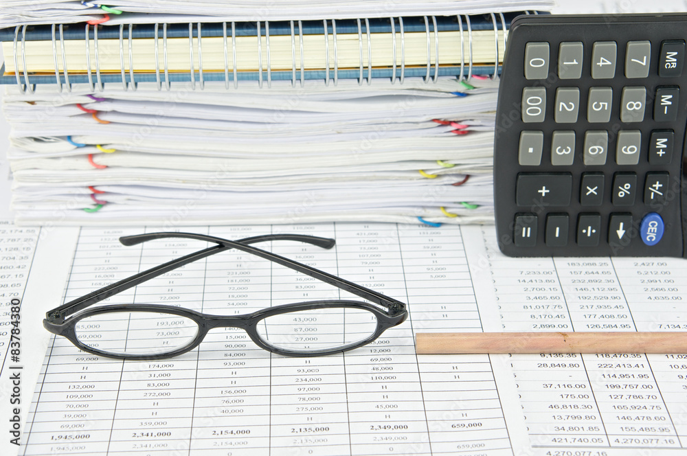 Bottom of brown pencil and spectacles on finance account Bottom of brown pencil and spectacles on finance account