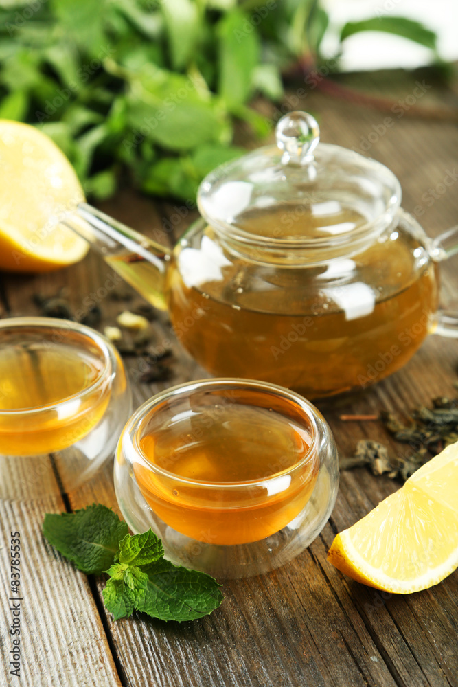 Cup with green tea on wooden background Cup with green tea on wooden background